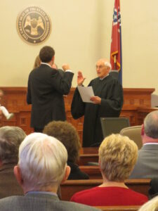 Josiah Coleman is sworn in as a member of the Mississippi State Supreme Court by his father, Judge Thomas A. Coleman