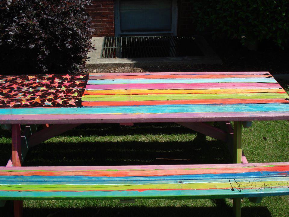 Among other artists, Nicole Lamar will paint an Adirondack rocker that will be auctioned in the Double Decker Picnic Area. Last year she painted this table, titled "Oh, Say, Can You See?" pictured here.