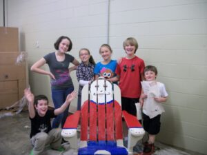 Andi Bedsworth's Art to Go class painted this Adirondack rocker tiled "Mustache Man" for the Double Decker Picnic Area on Saturday, April 27. Silent auction bids on the chair start at $100.