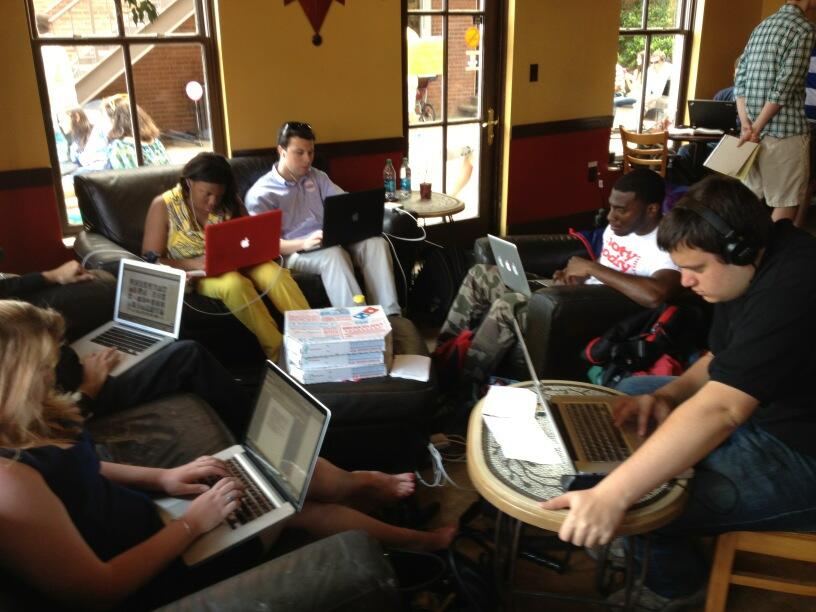 Meek School Journalism students hard at work inside Highpoint Coffee. / Photo By Deb Wenger