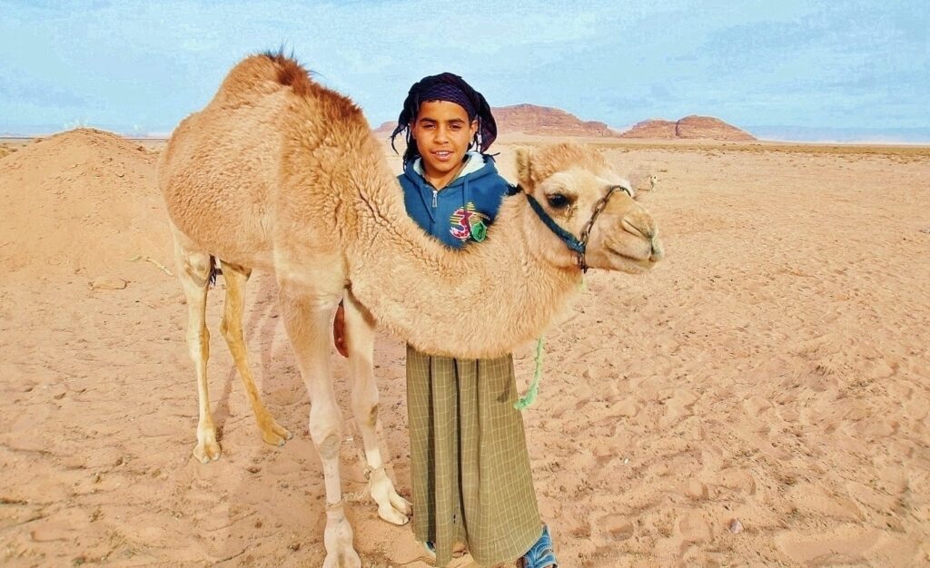 A young Jordanian boy proudly stands with his six-month old camel during a recent afternoon in the desert of southwest Jordan. Camels have long been a source of riches and survival for nomad tribes across the Middle East and elsewhere, and continue to play an important role today.