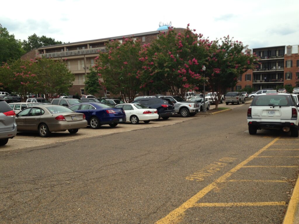 Parking lot behind city hall is under consideration as site for proposed new city parking garage. / Photo By Hillary Houston