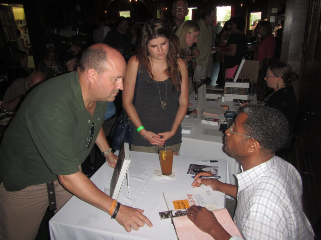 Lamar Lounge Owner John Currence, left, and HT.com/Experience Oxford's Hillary Houston at book-signing table with author Lolis Elie, pictured at right 