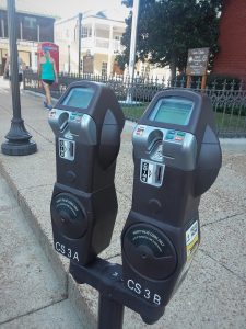 Hoods Coming Off Downtown Parking Meters
