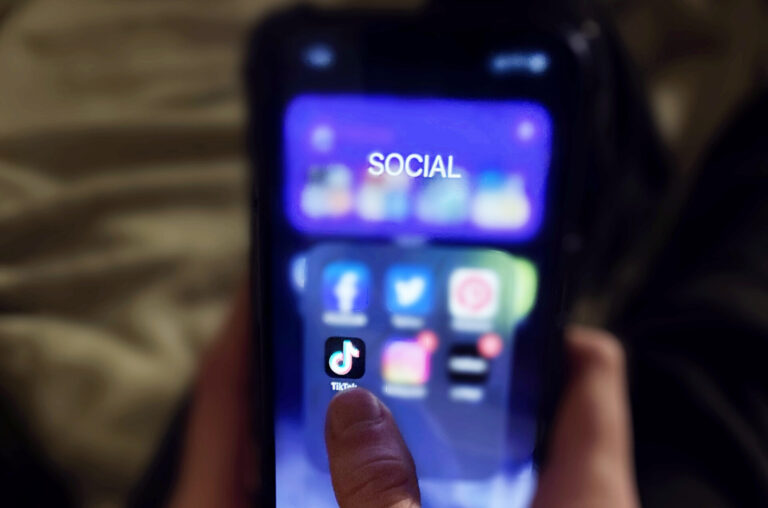 Photo of phone showing TikTok app