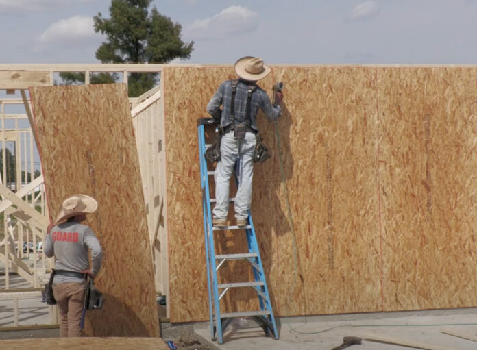 Men building a home