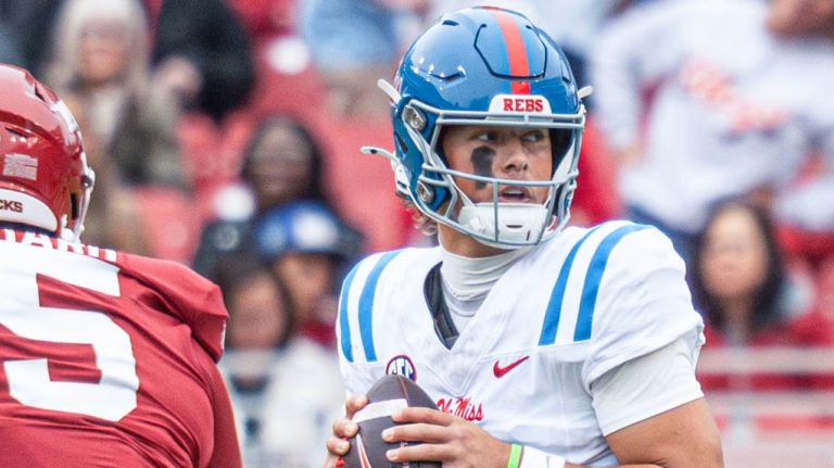 Ole Miss quarterback Jaxson Dart throws a pass against the Arkansas