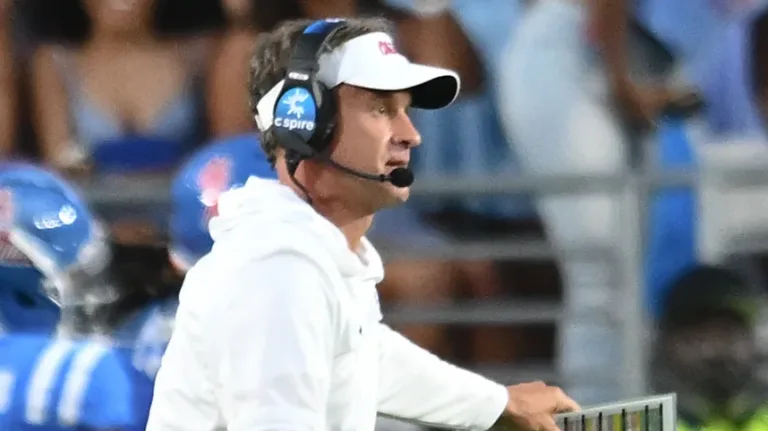 Ole Miss Rebels coach Lane Kiffin on the field during game with the Arkansas Razorbacks