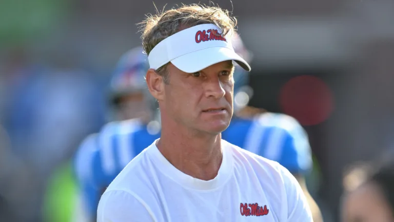 Ole Miss Rebels coach Lane Kiffin on the field during pregame warmups before game with the Arkansas Razorbacks