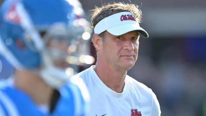 Ole Miss Rebels coach Lane Kiffin on the field in warmups before game with the Arkansas Razorbacks