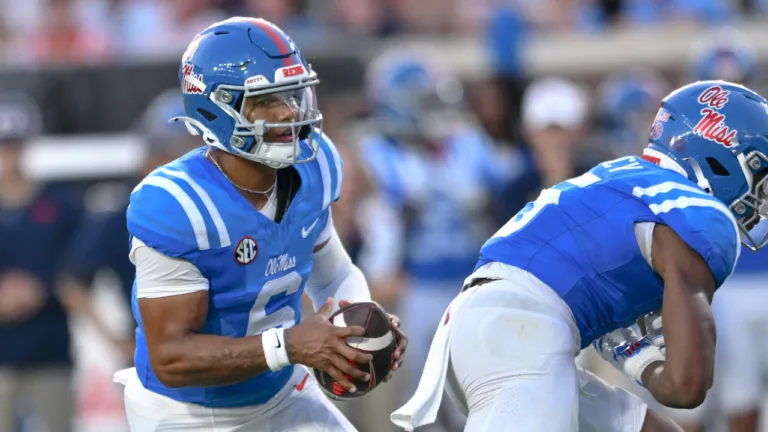 Ole Miss Rebels quarterback Trinidad Chambliss runs a play against the Arkansas Razorbacks