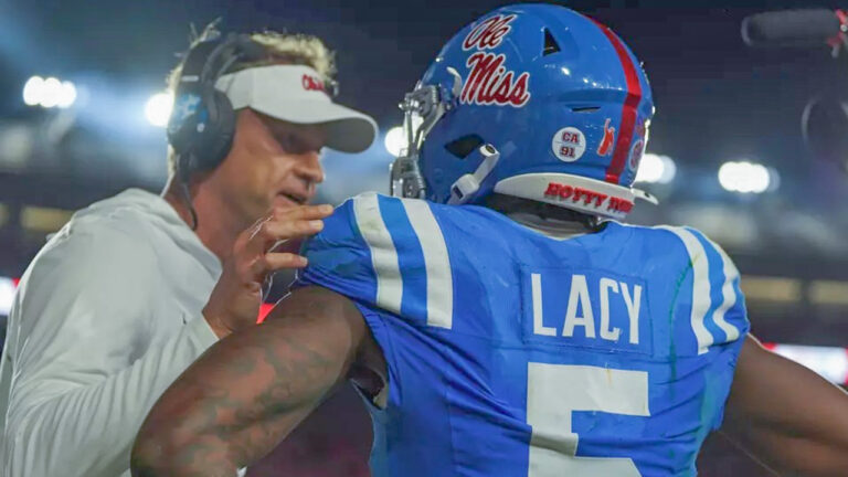 Ole Miss Rebels coach Lane Kiffin and running back Kewan Lacy on the sidelines in game against the Florida Gators