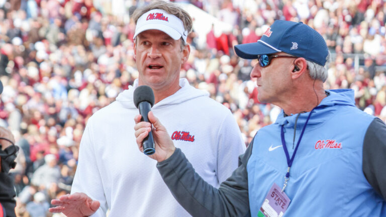 Ole Miss Rebels coach Lane Kiffin on the sidelines against the Mississippi State Bulldogs