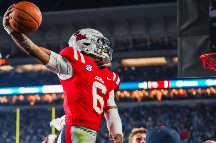 Ole Miss Rebels quarterback Trinidad Chambliss goes for a sideline dunk during game against the South Carolina Gamecocks