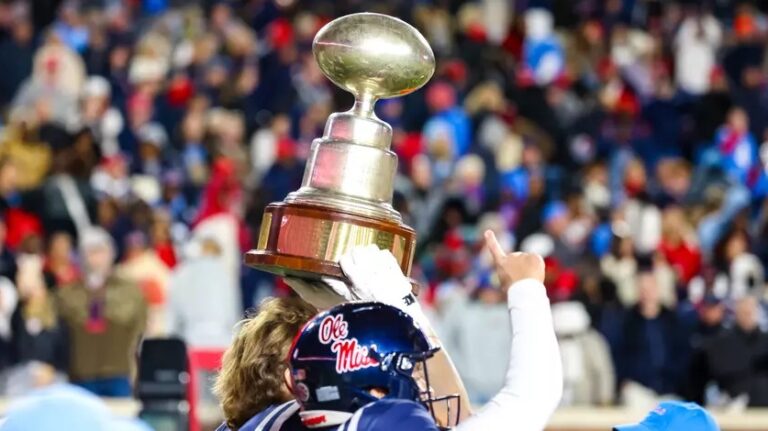 Ole Miss players celebrate with the Golden Egg trophy after last year's 26-14 win in Oxford.
