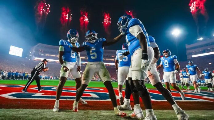 Ole Miss players celebrate a touchdown with Kewan Lacy against South Carolina.