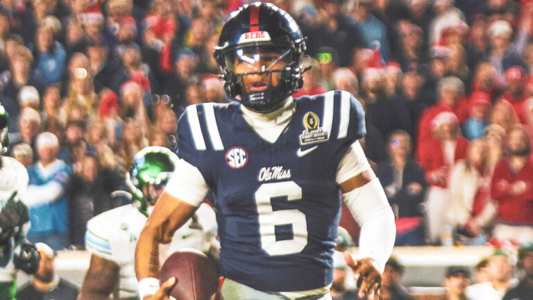 Ole Miss Rebels quarterback Trinidad Chambliss carries the ball against the Tulane Green Wave