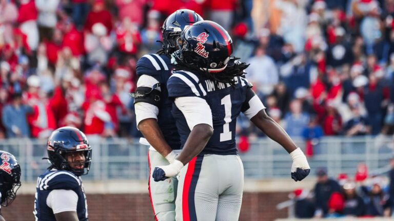 Ole Miss defenders celebrate a stop against Tulane in the first half of Saturday's first round College Football Playoff game. | Ole Miss Athletics