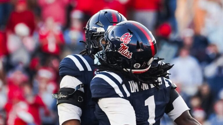 Ole Miss defenders celebrate a stop against Tulane in the first half of Saturday's first round College Football Playoff game. | Ole Miss Athletics