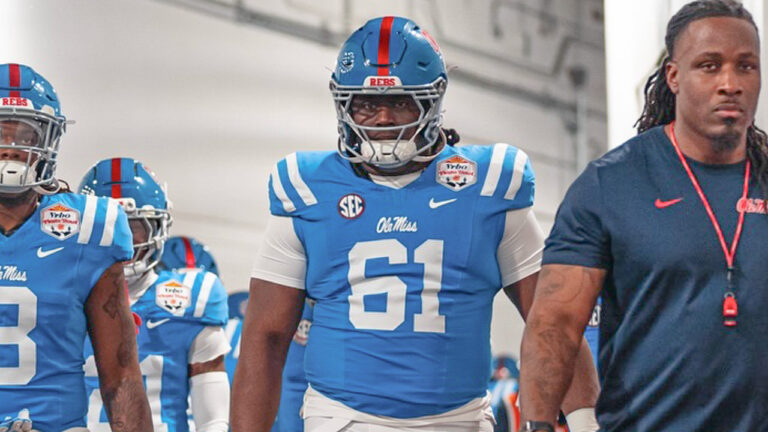 Ole Miss Rebels offensive lineman Delano Townsend walks down the ramp to take the field before the Fiesta Bowl