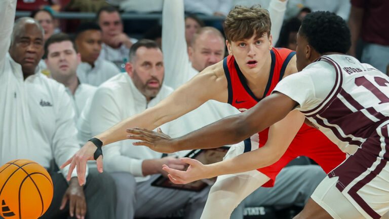 Ole Miss Rebels guard Eduardo Klafke makes a pass in game with the Mississippi State Bulldogs