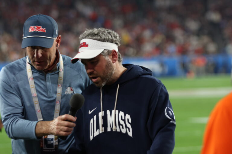Ole Miss coach Pete Golding talks on the field during a radio interview at the Fiesta Bowl on Thursday. | Bill Taylor-HottyToddy.com Images