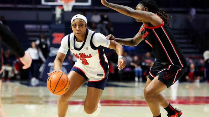 Ole Miss senior guard Kaitlin Peterson drives past a Georgia defender during Thursday's SEC opening game in Oxford. | Ole Miss Athletics