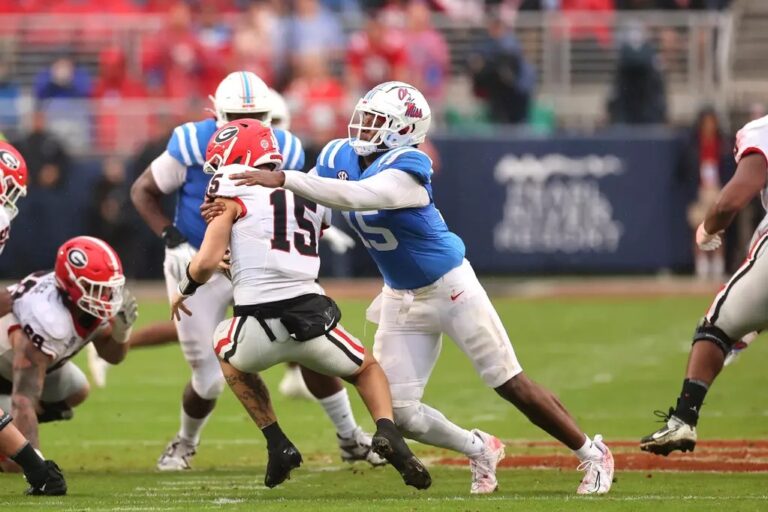 Ole Miss linebacker Jared Ivey tackles Georgia quarterback Carson Beck in a 2024 game. | Ole Miss Athletics