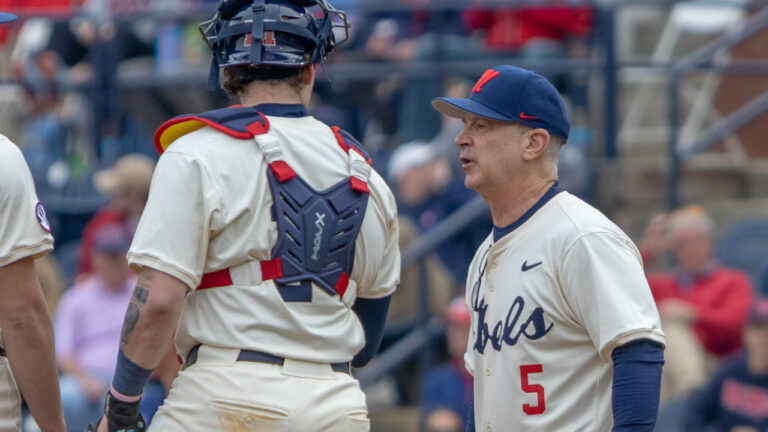 Ole Miss coach Mike Bianco coming to the mound against Nevada