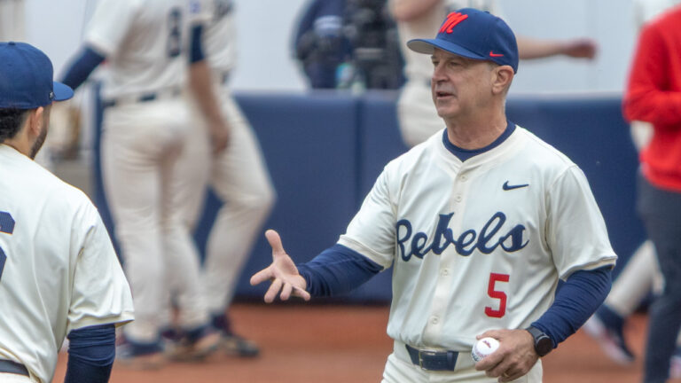 Ole Miss coach Mike Bianco coming to the mound against Nevada.