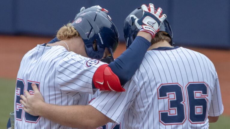 Ole Miss Rebels Daniel Pacella with teammates after hitting homer