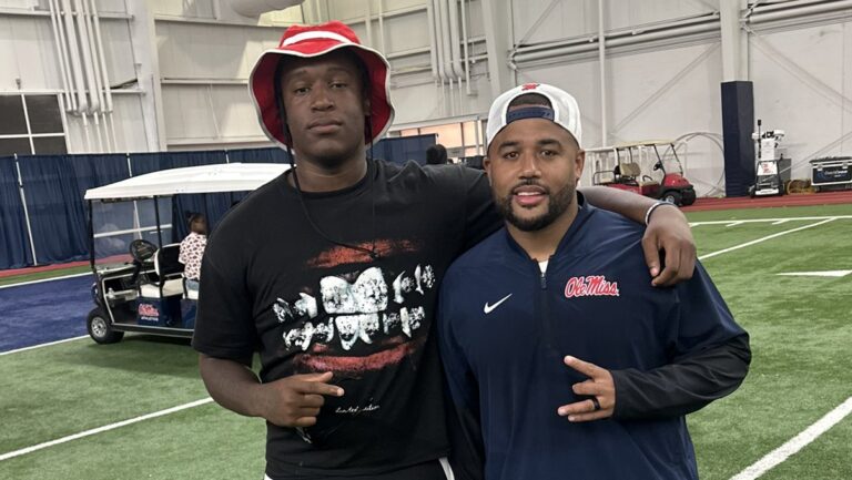 Ackerman defensive lineman Ben'Jarvius Shumaker and Ole Miss defensive line coach Randall Joyner. | Photo Credit: Ben'Jarvius Shumaker/X