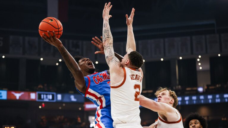 Ole Miss guard AJ Storr is fouled on a layup attempt against Texas on Saturday in Austin. | Ole Miss Athletics