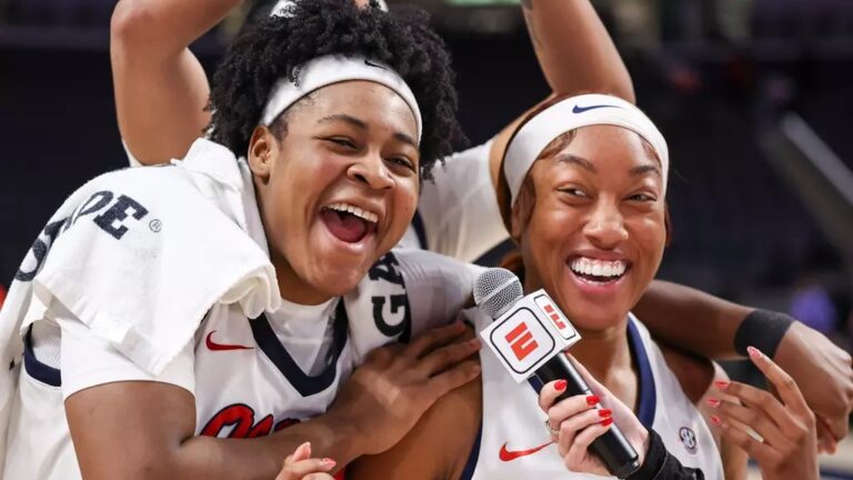 Ole Miss senior Christeen Iwuala, left, celebrates with Cotie McMahona in a post-game television interview after Monday's win against Auburn. | Ole Miss Athletics
