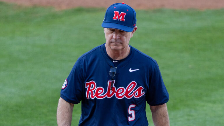 Ole Miss coach Mike Bianco walks off the field after a mound visit. | Dylan Cohron-HottyToddy.com Images