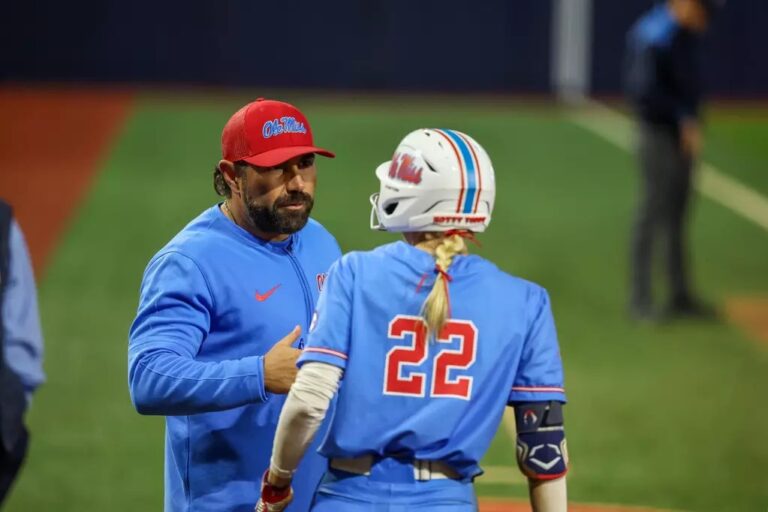 Ole Miss assistant coach Bobby Buchanan talks with Taylor Malvin during a SEC game against No. 4 Oklahoma. | Ole Miss Athletics