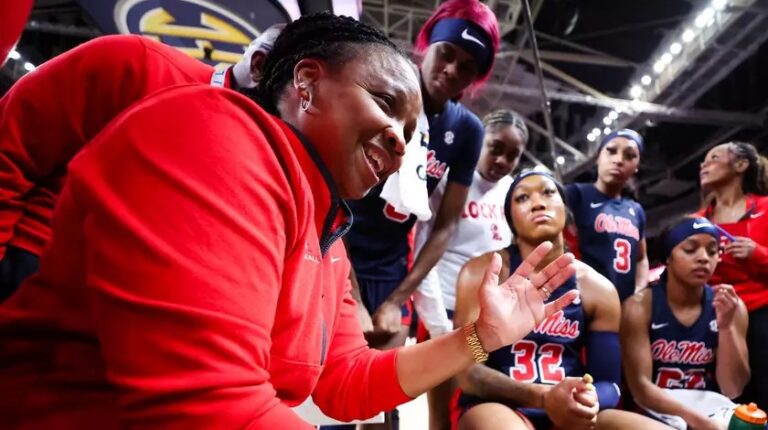 Ole Miss coach Yolett McPhee-McCuin talks with her players during Saturday's SEC Tournament semifinal game against Texas. | Ole Miss Athletics