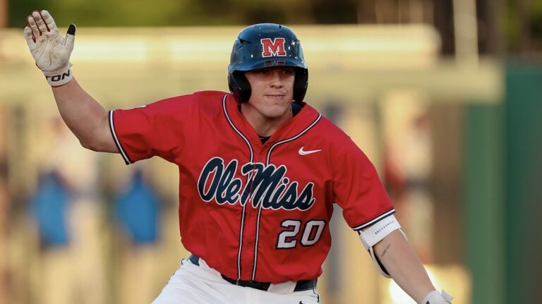 Ole Miss designated hitter Collin Reuter celebrates a base hit during a SEC game against No. 21 Florida. | Ole Miss Athletics