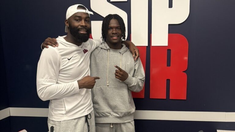 Ole Miss wide receivers coach L'Damion Washington with Lausanne Collegiate WR Lawrence Britt. Lawrence Britt/X