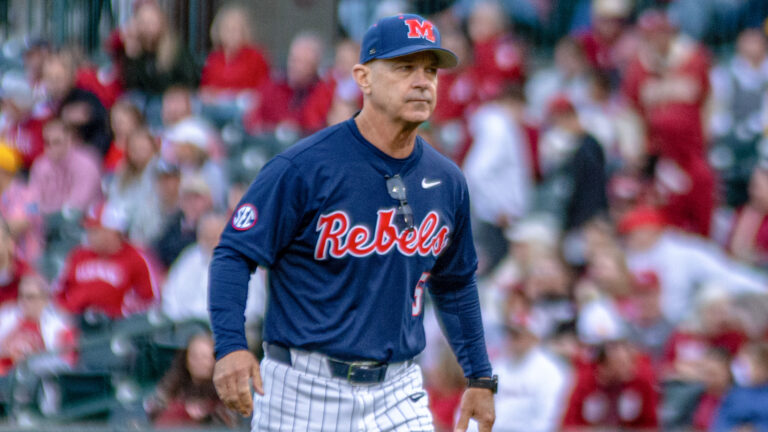 Ole Miss coach Mike Bianco walks off the field Friday at Baum Walker Stadium in Fayetteville, Ark. | Nilsen Roman-HottyToddy.com