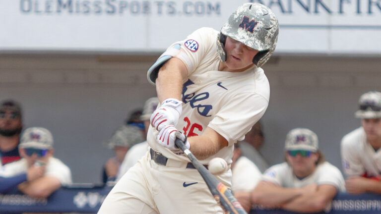 Ole Miss first baseman Will Furniss hits a fly ball in the first half of a double-header against Texas A&M at Swayze Field. | Ole Miss Athletics