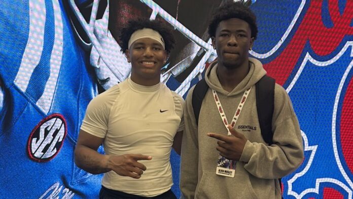 Ole Miss quarterback Trinidad Chambliss, left, with Crawford wide receiver Alvin Mosley. | Alvin Mosley/X
