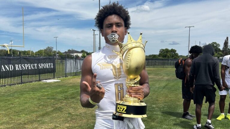Port Charlotte (Fla.) wide receiver poses with a 7-on-7 championship trophy from The Crown 2026 National Championship. | Elias Pearl/X