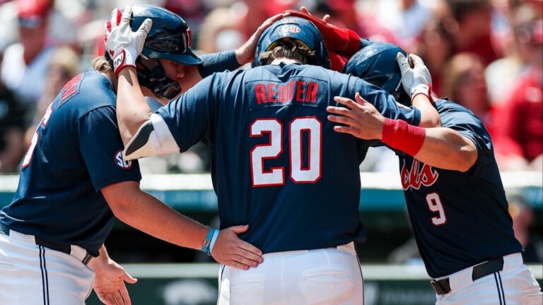 Ole Miss DH Collin Reuter celebrates his home run with Will Furniss and Hayden Federico in Saturday's win against No. 22 Arkansas. | Ole Miss Athletics