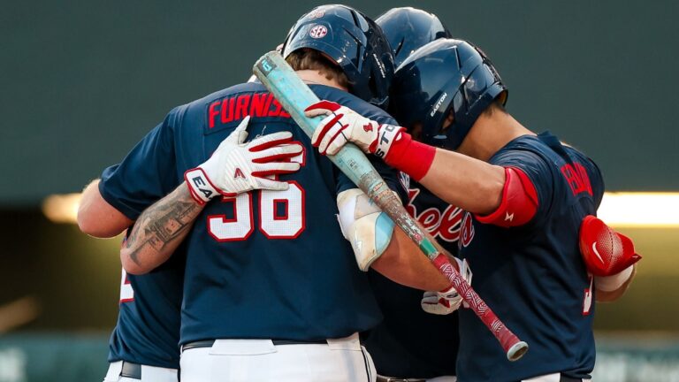 Ole Miss players gather together to celebrate a home run against No. 18 Alabama. | Ole Miss Athletics