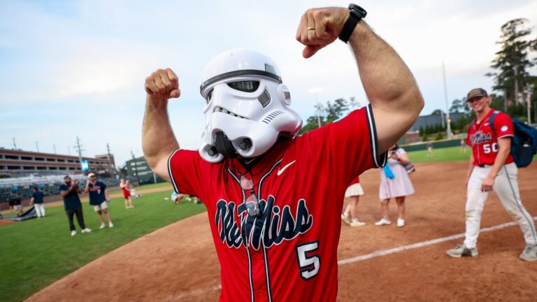 Ole Miss coach Mike Bianco dons the Rebels' stormtrooper helmet after Ole Miss punched its ticket to the College World Series. | Ole Miss Athletics
