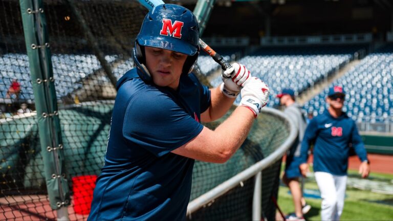 Ole Miss first baseman Will Furniss warms up before a College World Series game against Troy. | Ole Miss Athletics