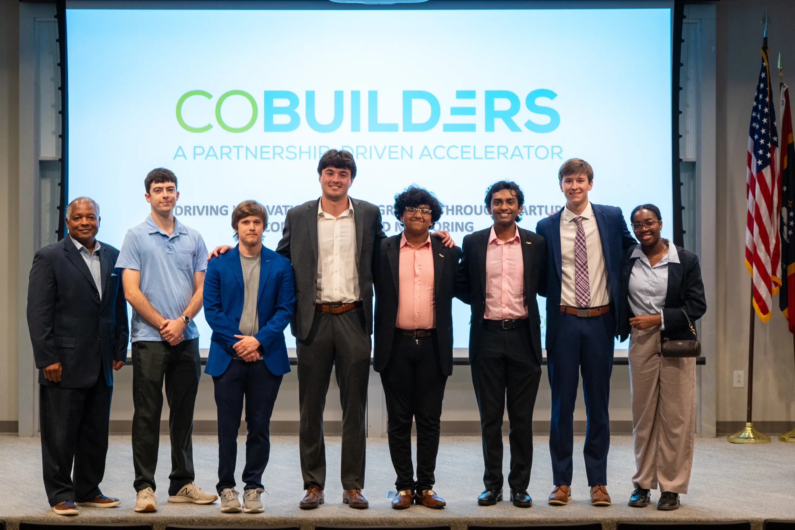 Innovate Track finalists pose on stage at the CoBuilders Oxford Pitch Competition.