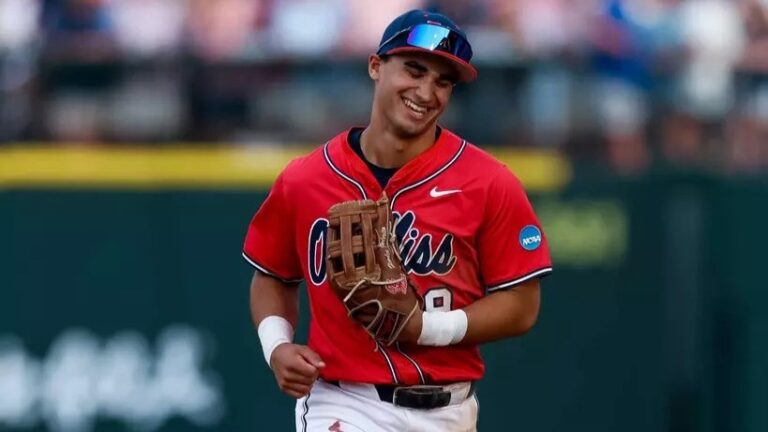 Ole Miss center fielder Hayden Federico jogs back to the Rebels' dugout after an inning-ending catch against Auburn. | Ole Miss Athletics