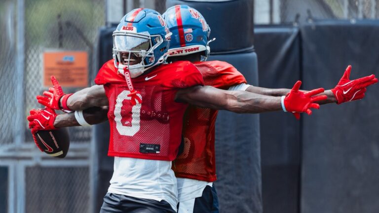 Ole Miss wide receiver Johntay Cook III celebrates with a teammate during a preseason practice. | Ole Miss Athletics
